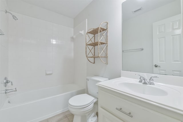 full bathroom with tile patterned floors, toilet, tiled shower / bath combo, and vanity