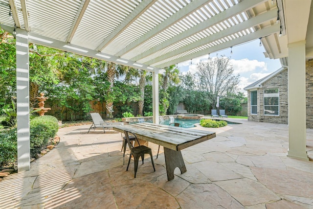 view of patio with a swimming pool with hot tub and a pergola