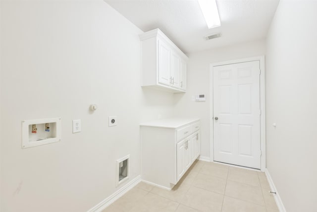 laundry room featuring light tile patterned flooring, cabinets, electric dryer hookup, washer hookup, and hookup for a gas dryer