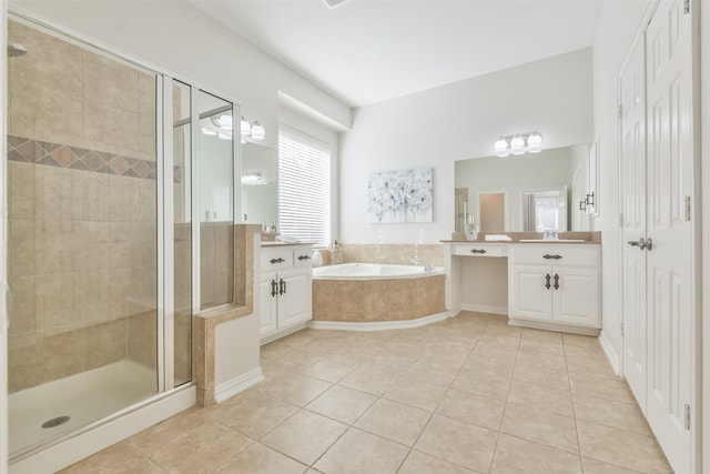 bathroom with tile patterned flooring, vanity, and independent shower and bath