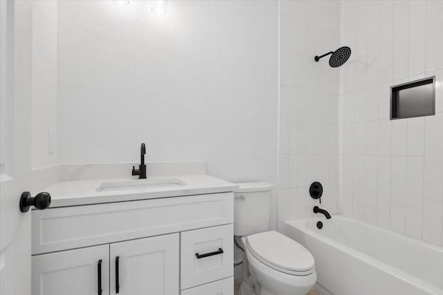 bathroom featuring toilet, vanity, and bathing tub / shower combination