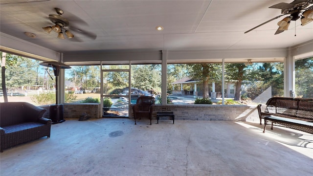 sunroom featuring plenty of natural light and ceiling fan