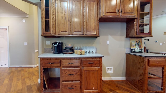 kitchen featuring light hardwood / wood-style floors and ornamental molding