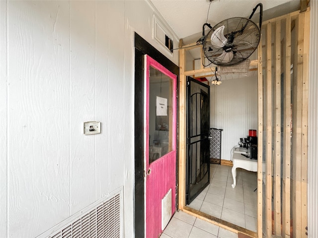 hallway with light tile patterned floors