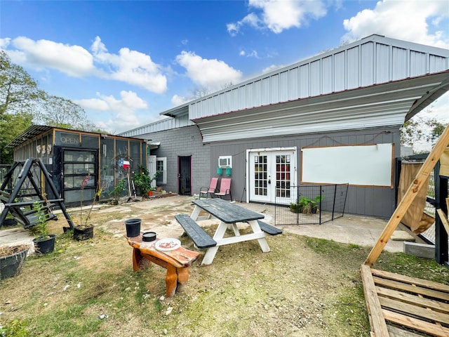 back of property featuring french doors