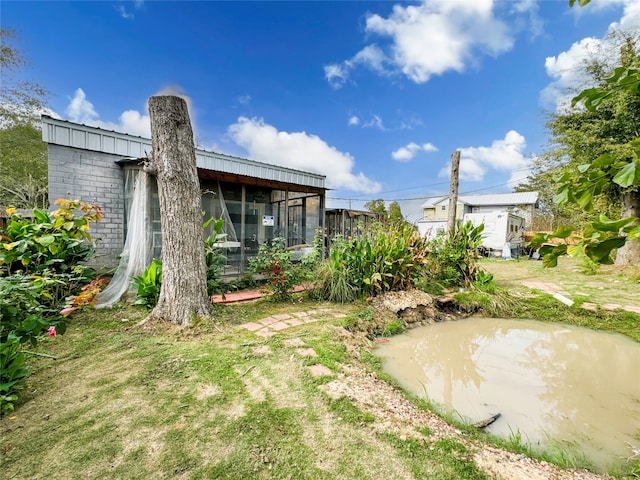 view of yard with a sunroom