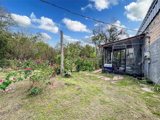 view of yard featuring a sunroom