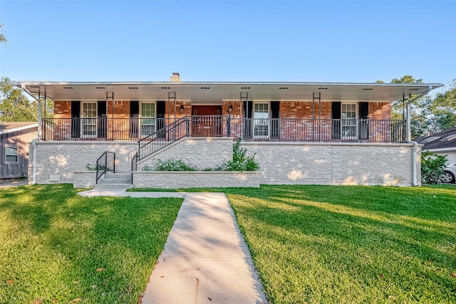 view of front of home with a front lawn and covered porch