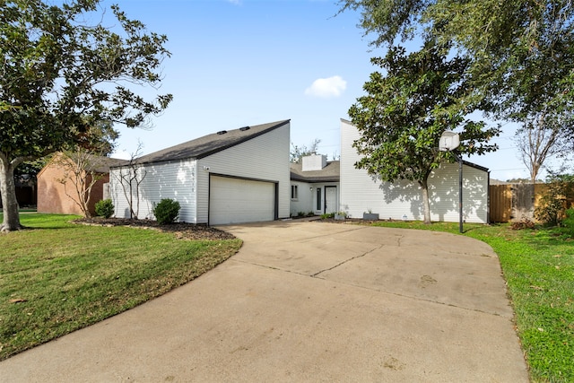 view of front of house with a front lawn and a garage