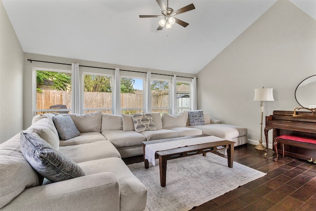 living room featuring plenty of natural light, ceiling fan, dark hardwood / wood-style flooring, and high vaulted ceiling