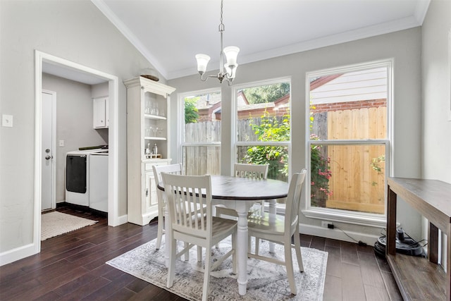 dining area featuring washer and dryer, crown molding, dark wood-type flooring, and a notable chandelier