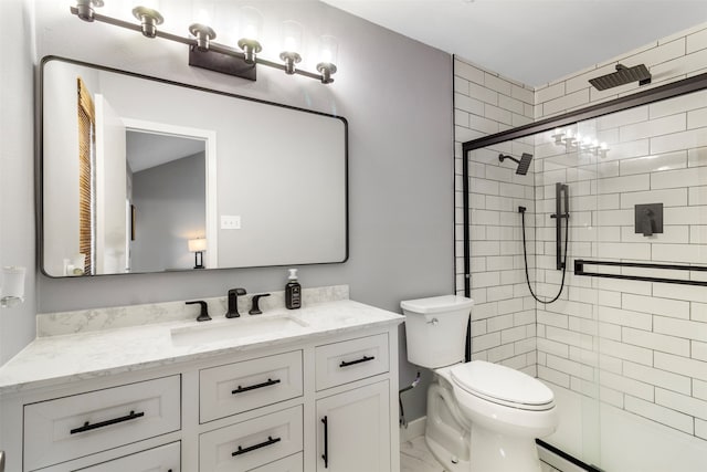 bathroom featuring vanity, toilet, a shower with shower door, and a baseboard heating unit