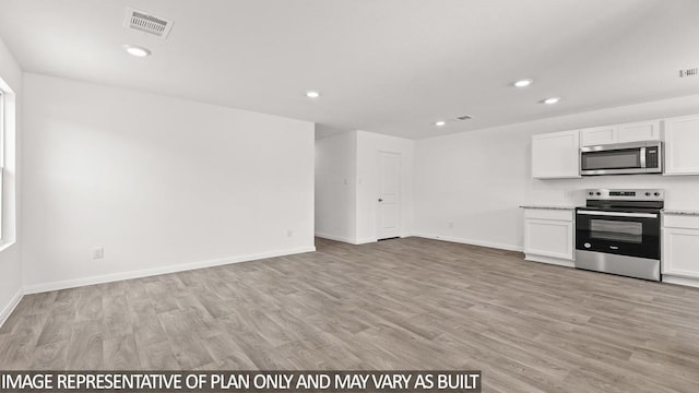 kitchen with white cabinetry, appliances with stainless steel finishes, and light hardwood / wood-style flooring