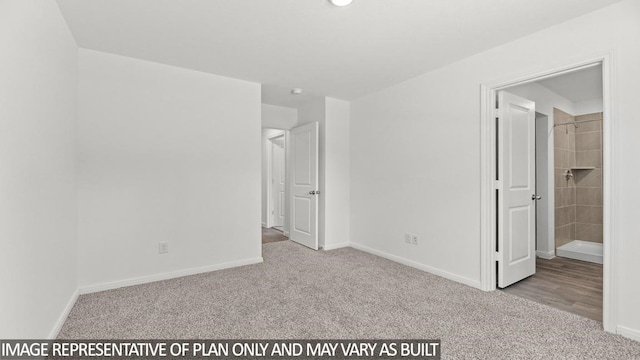 unfurnished bedroom with ensuite bathroom and light colored carpet