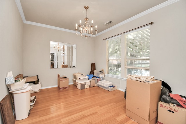 misc room with ornamental molding, a chandelier, and hardwood / wood-style flooring