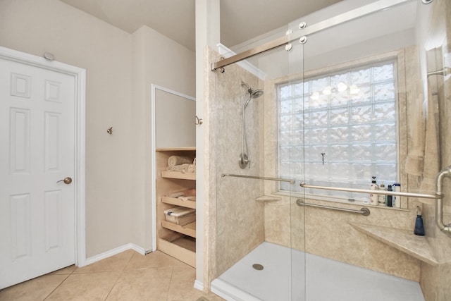 bathroom featuring tile patterned floors and a shower with door