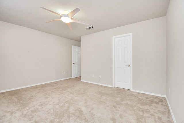 unfurnished room with light carpet and ceiling fan