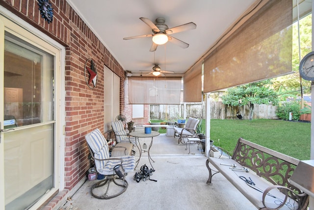 sunroom featuring ceiling fan