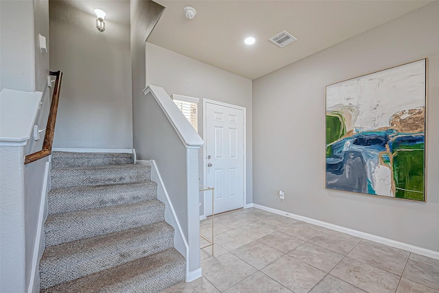 foyer featuring light tile patterned floors