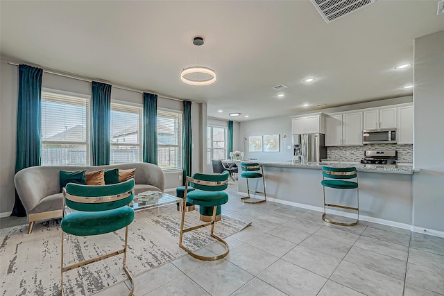 living room with light tile patterned floors