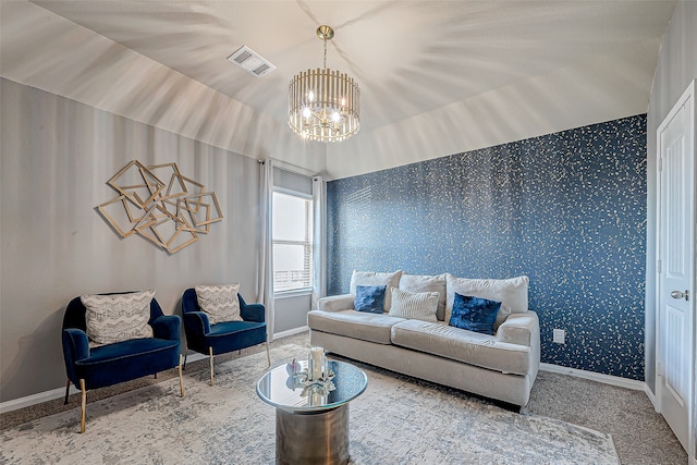 living room with carpet and a chandelier