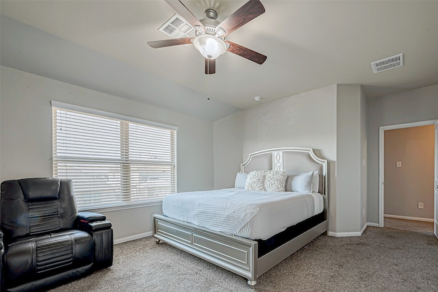 carpeted bedroom with multiple windows and ceiling fan