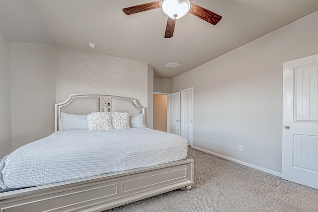 bedroom with carpet floors, vaulted ceiling, and ceiling fan