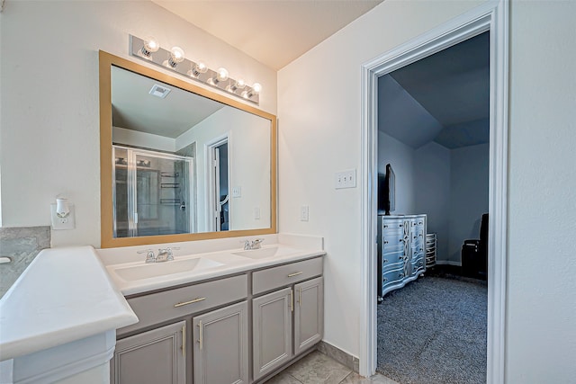 bathroom with vanity and a shower with shower door