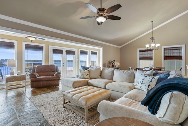 living room with crown molding, a water view, ceiling fan with notable chandelier, and high vaulted ceiling