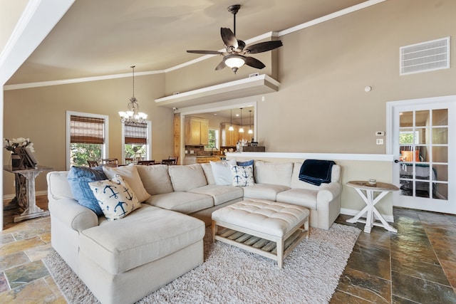 living room with ornamental molding and a healthy amount of sunlight