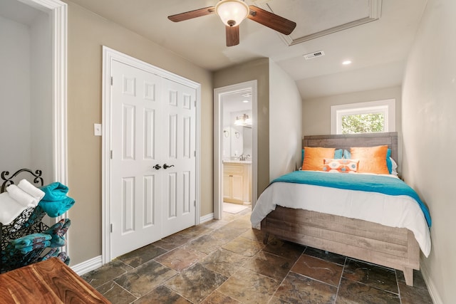 bedroom with ceiling fan, a closet, and ensuite bath