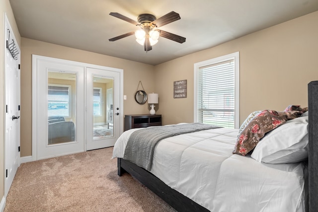 bedroom featuring carpet floors, access to outside, and ceiling fan