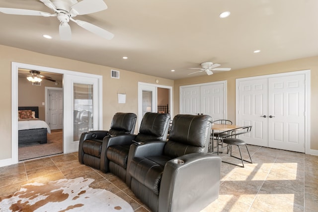 home theater with french doors and ceiling fan