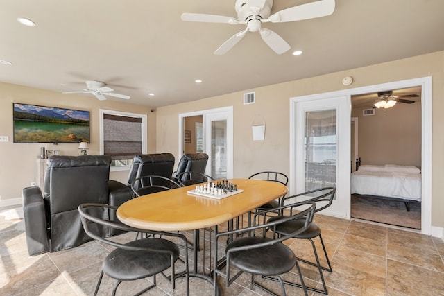 dining room with french doors and ceiling fan