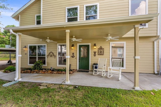 doorway to property with ceiling fan