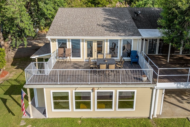 back of house featuring a balcony