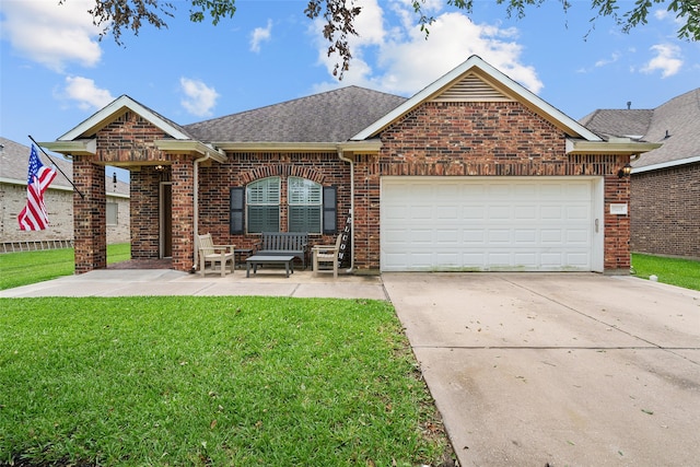 view of front of house with a garage and a front yard