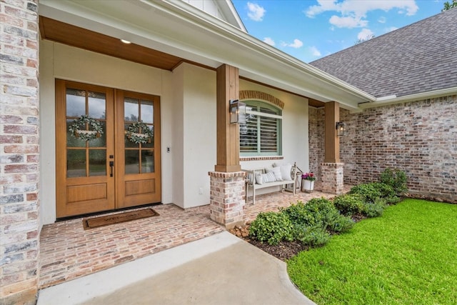 doorway to property featuring french doors and a porch