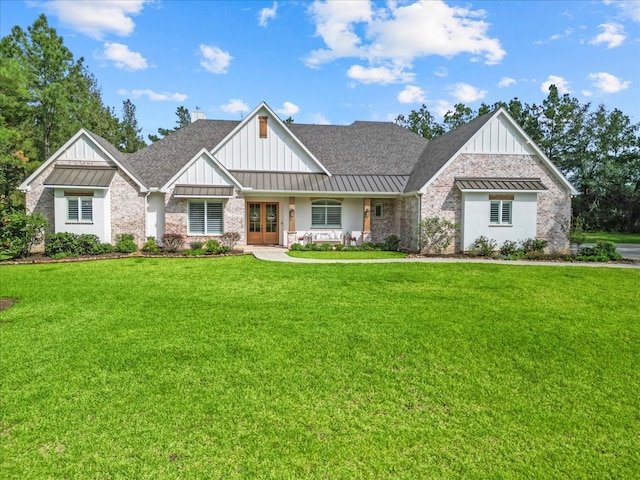 view of front of property with french doors and a front yard