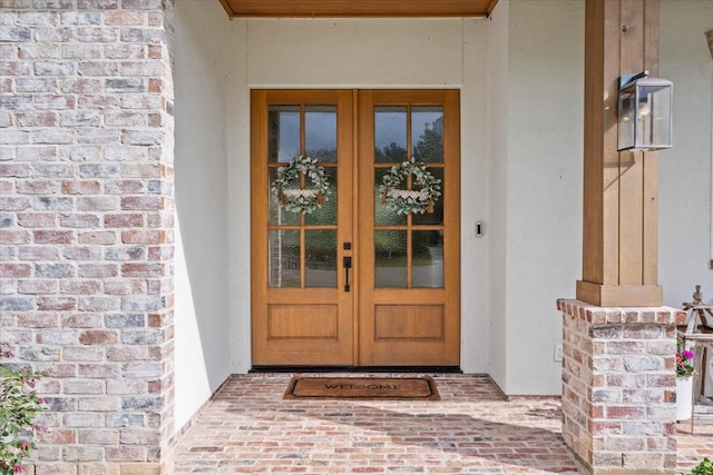 view of exterior entry featuring french doors