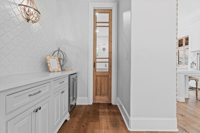 interior space featuring light wood-type flooring and beverage cooler