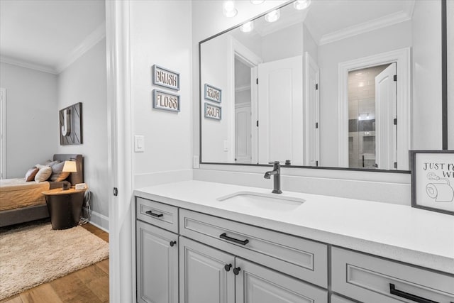 bathroom featuring vanity, wood-type flooring, crown molding, and walk in shower