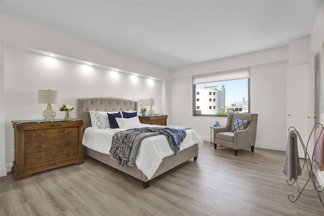 bedroom with light hardwood / wood-style flooring