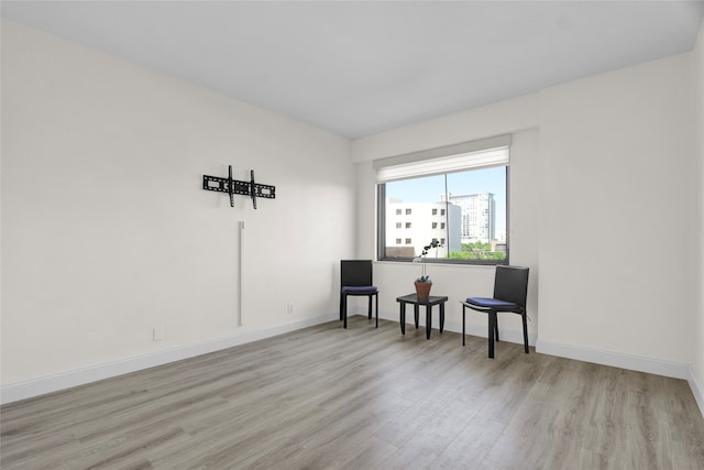 empty room with light hardwood / wood-style floors