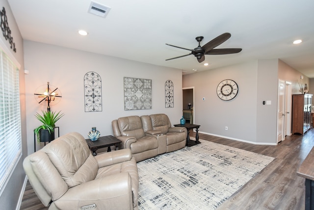 living room with hardwood / wood-style floors and ceiling fan