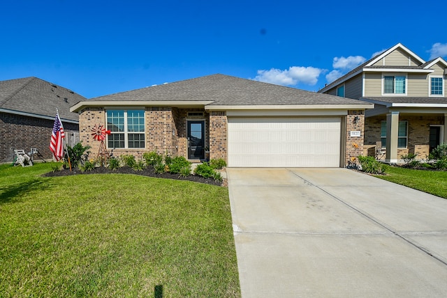 view of front of property featuring a front yard and a garage