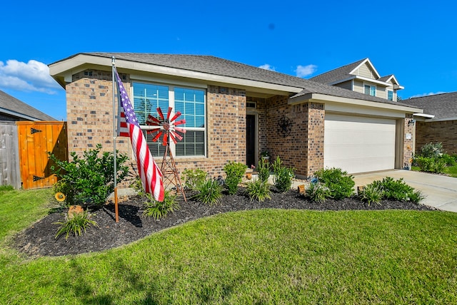 view of front of house featuring a garage and a front yard