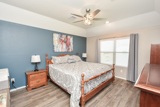 bedroom with hardwood / wood-style flooring and ceiling fan