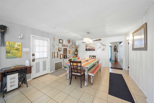 dining space with light tile patterned flooring