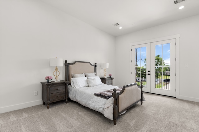 bedroom featuring access to exterior, french doors, and light carpet